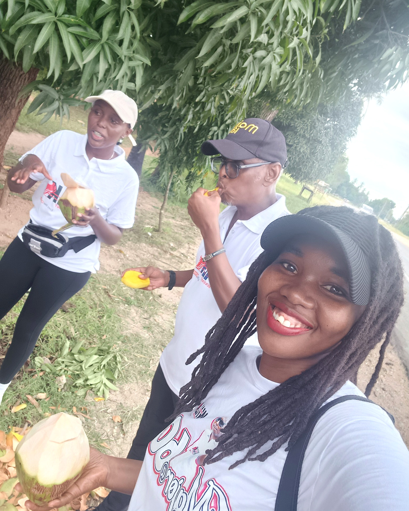 Walkers enjoying fresh mangoes and madafu during the journey