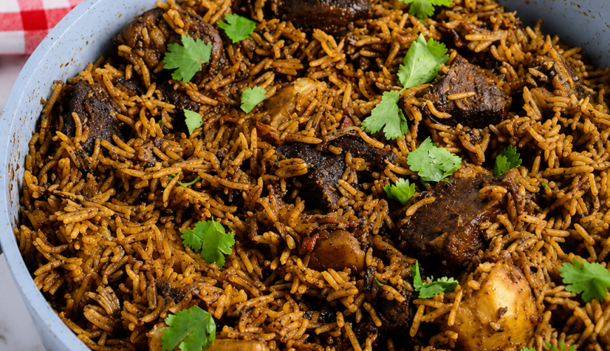 Pot of coastal pilau served with kachumbari.